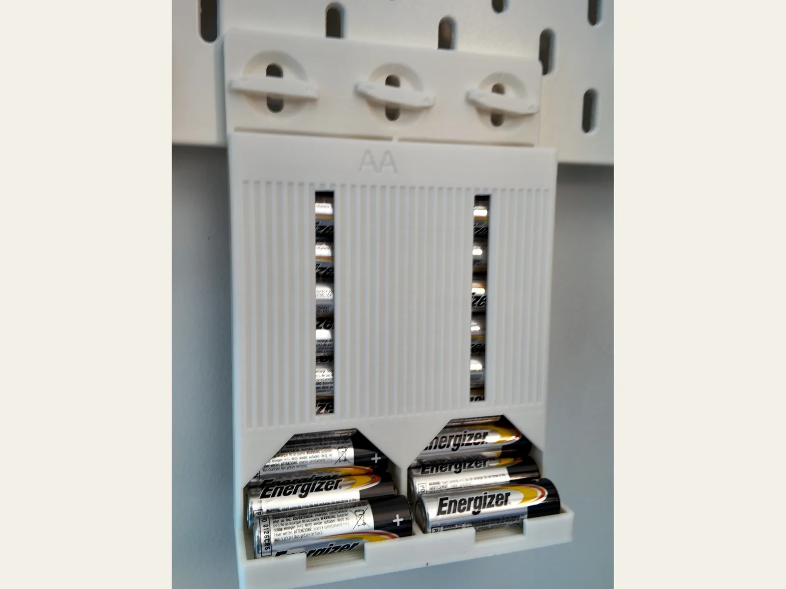 Photo: the printed AA battery dispenser on SKADIS, loaded with AA cells